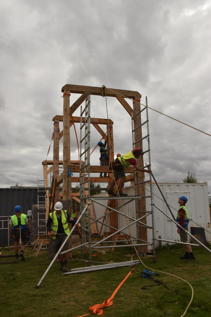 With ropes, winches, hoists, muscle power and team work, the frame is raised
