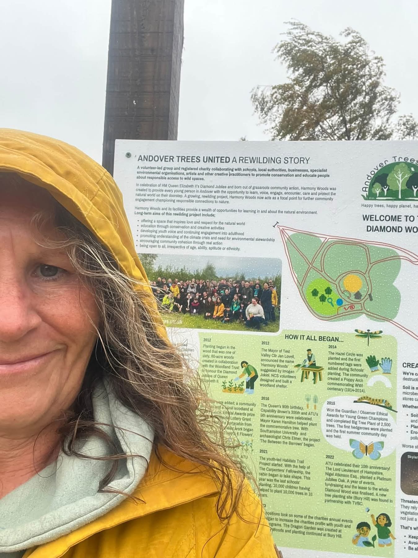 Tara stops to admire one of the new signs.JPG