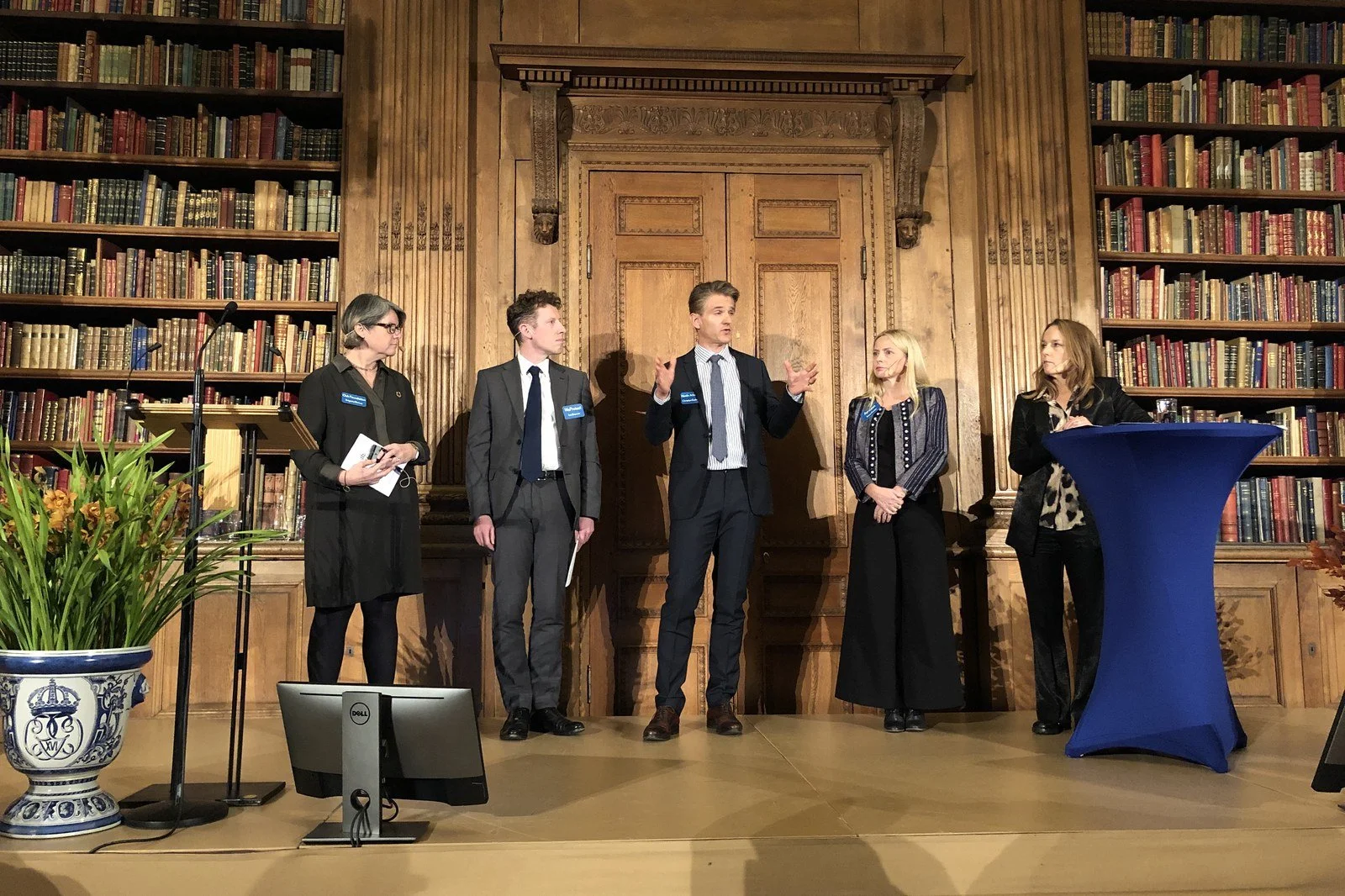 Christian Guttmann speaking on stage with four other panellists at the AI and online child protection workshop in the Bernadotte Library, Royal Palace, Stockholm, 2019