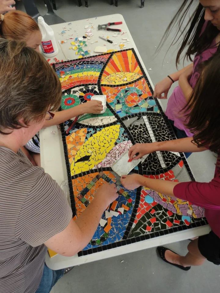 Participants working on mural