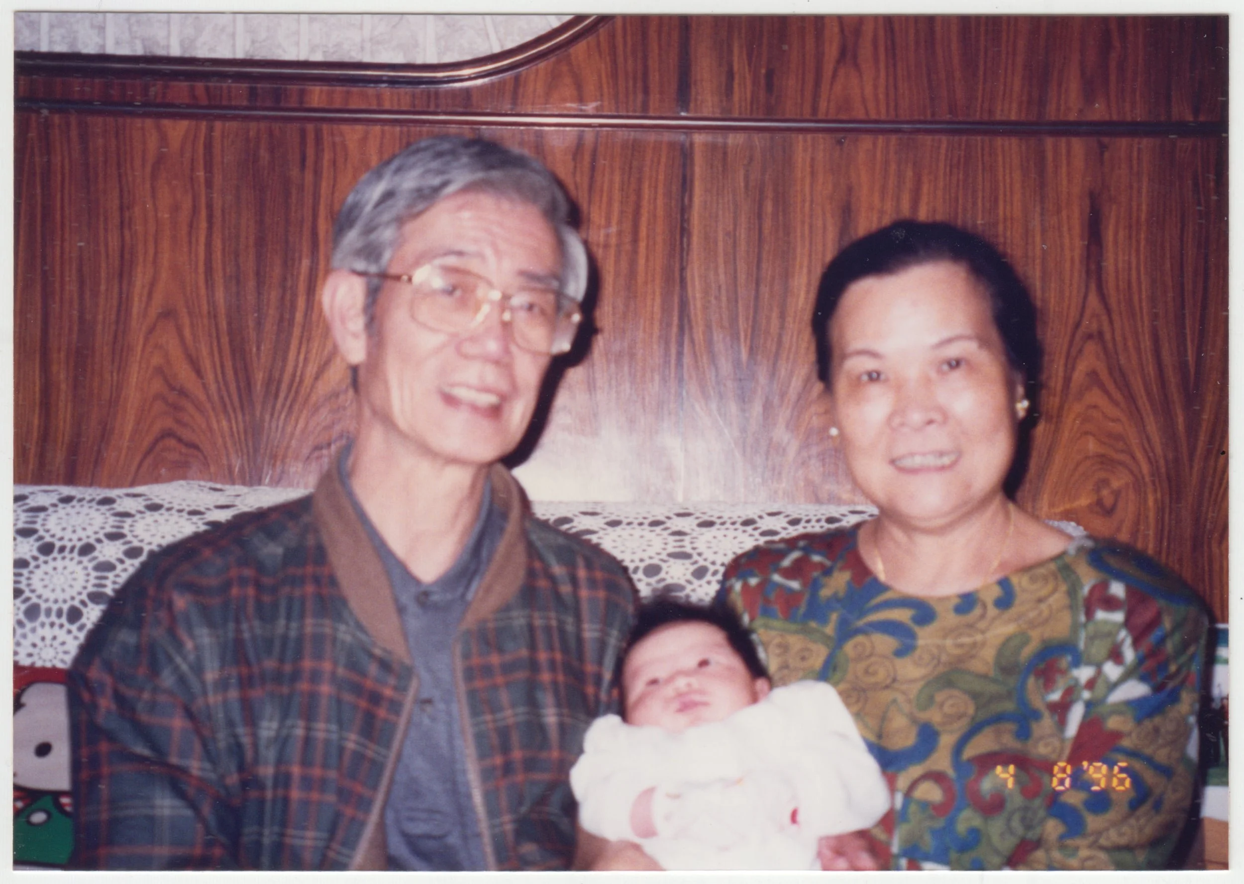 Grandparents with Charlotte at home on 18/F, taken on 8 April 1996.