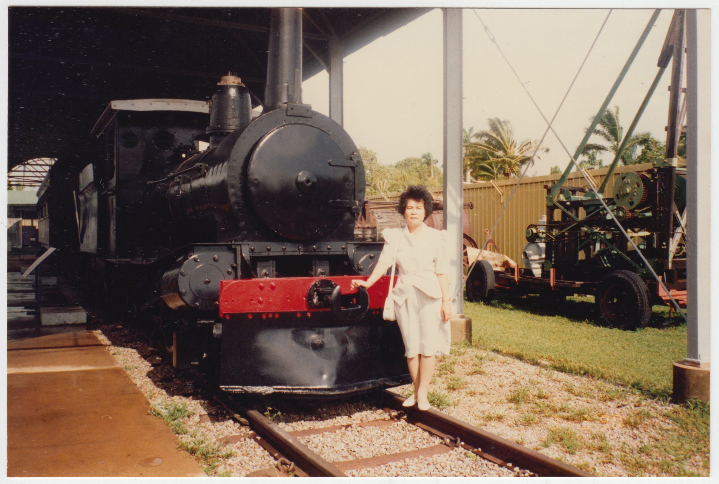 Grandma  posing next to a steam train in Australia, c. March 1990.