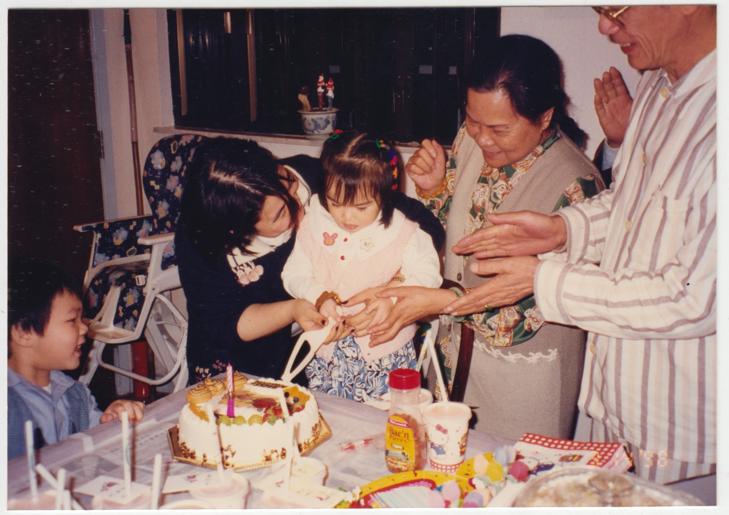 no. 00237 / Grandpa, Grandma, Mum, Charlotte & Leon Wan on 19/F Emma Avenue at Charlotte’s belated birthday party. Taken on 14 March 1996.