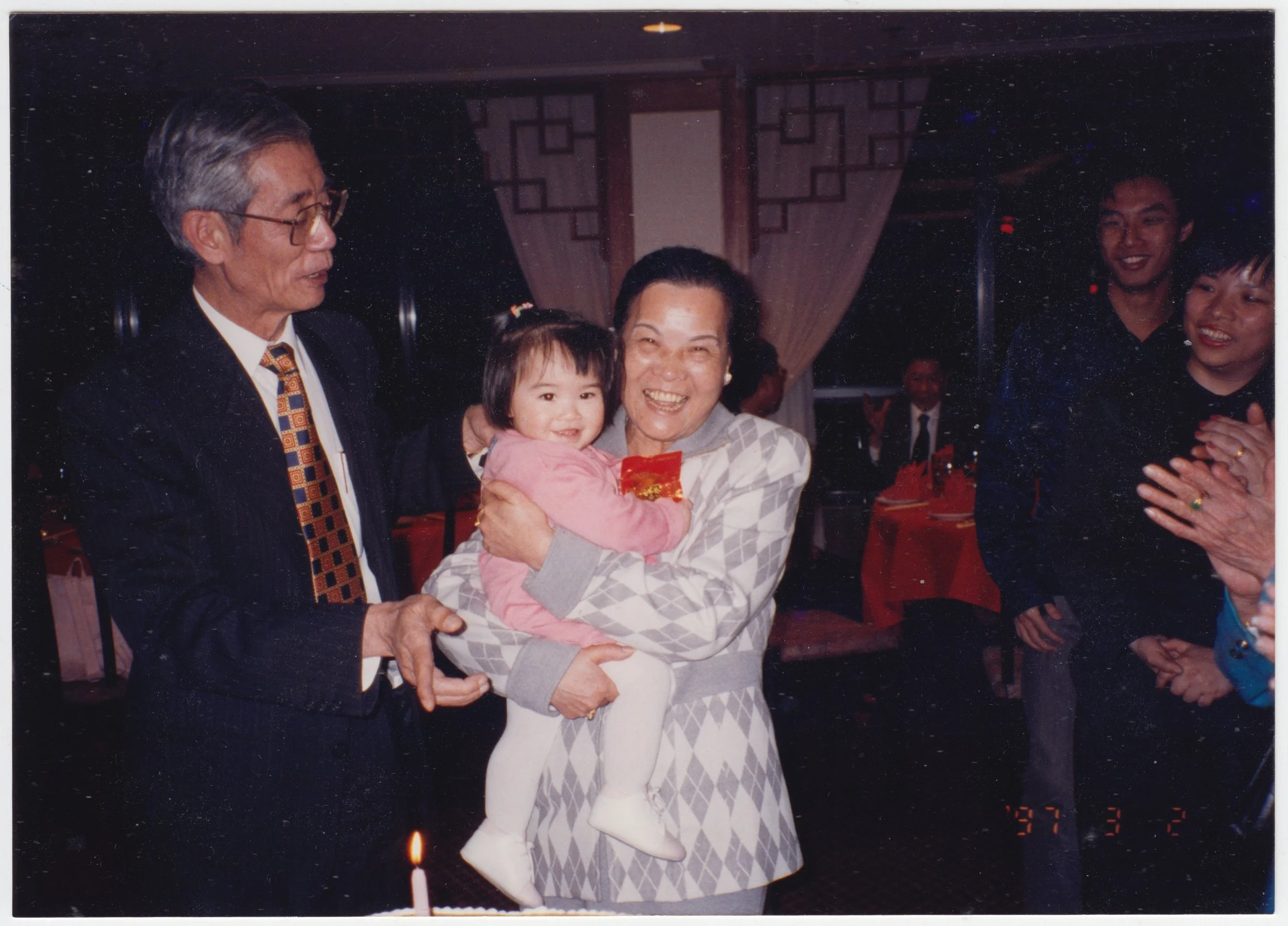 Grandpa, Grandma & Charlotte at Chinese New Year Banquet, c. 3 February 1997. Behind, you can see Kevin Tang and my 契媽, who was an employee of Marble but for some reason really liked me.