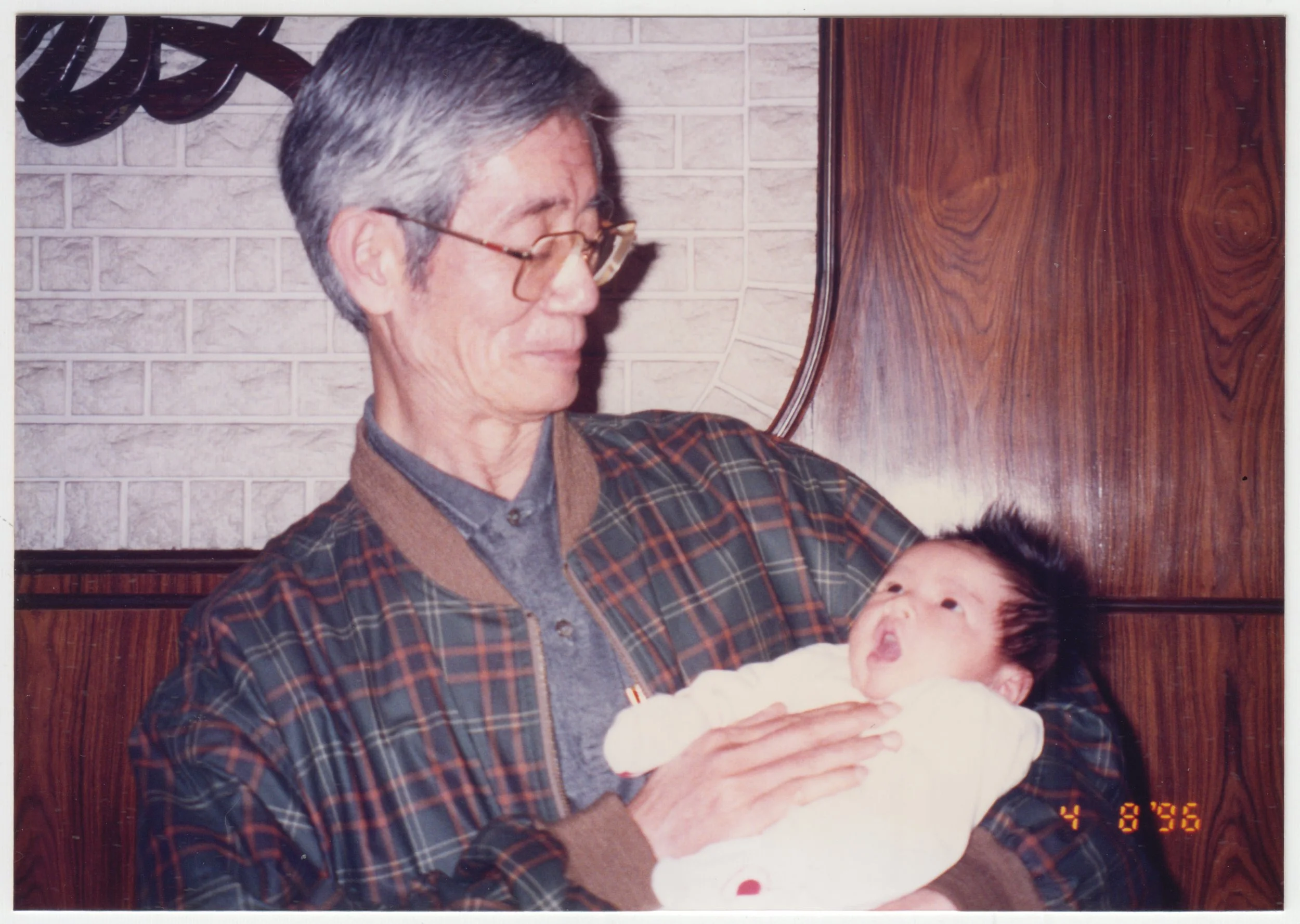 Grandpa & Charlotte at home on 18/F, taken on 8 April 1996.