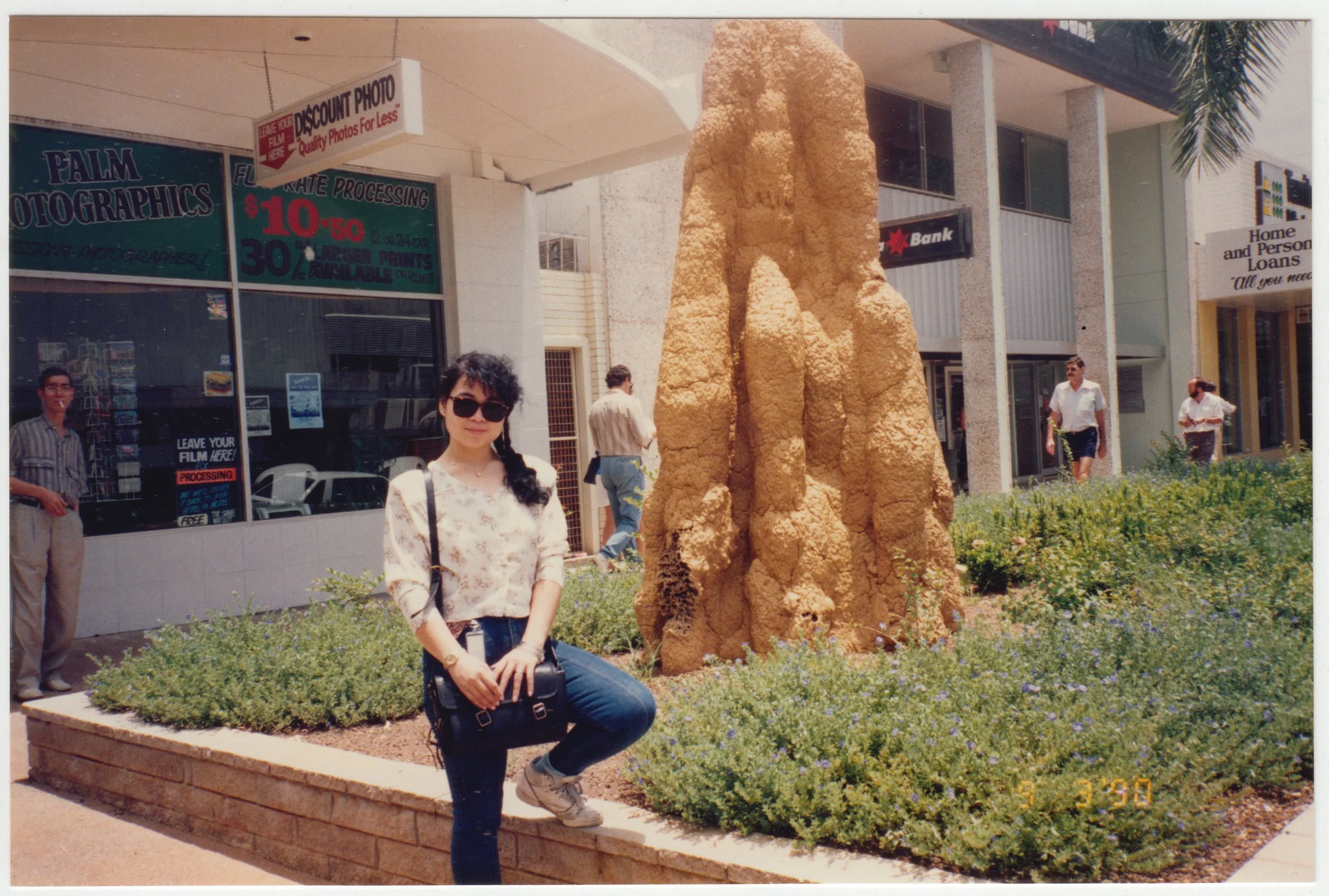 Mum posing next to a termite hill in Australia, taken on 9 March 1990