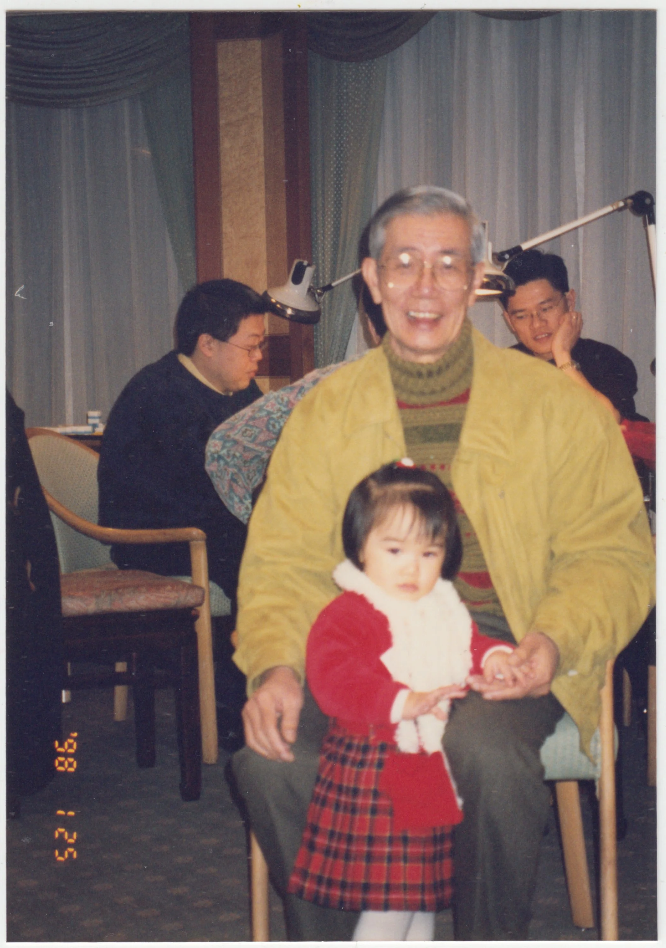 Grandpa & Charlotte at a Family Banquet on 25 January 1998. Uncle Edward can be seen at the back playing Mahjong with relatives. 