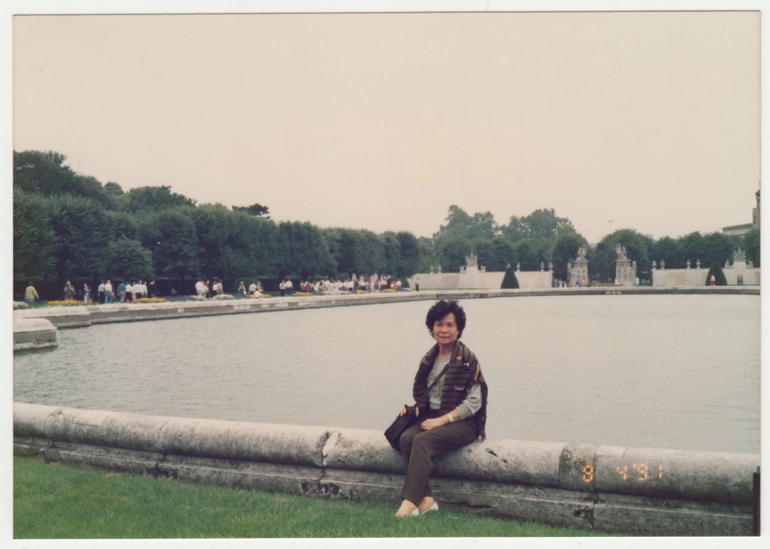 Grandma posing in front of a pond, 4 August 1991.