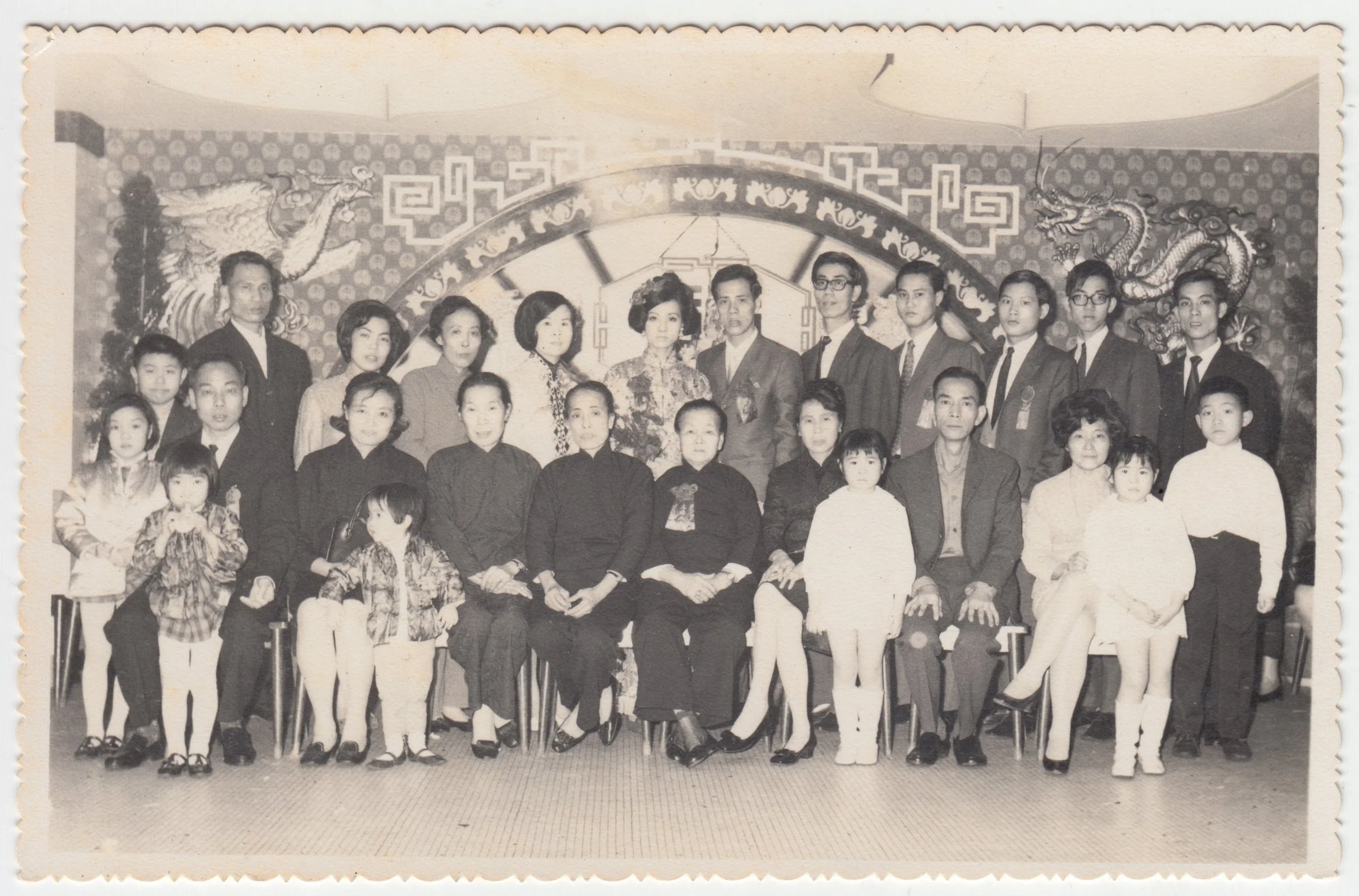 牛表叔婆 & 牛表叔公’s Wedding, c. 1970s.	

From left to right:

Back: Uncle Edward, 四姑丈公, 四姑婆 , 表姑媽, Grandma, 牛表叔婆, 牛表叔公, Grandpa, Chu 表叔公, 德群表叔公 (Lut Fu 表叔公), Tsui Wai Yuen 表叔公, 三叔公.

Front: Tsui Wai Yuen 表叔公’s sisters, Tsui Wai Yuen 表叔公’s dad, Tsui Wai Yue