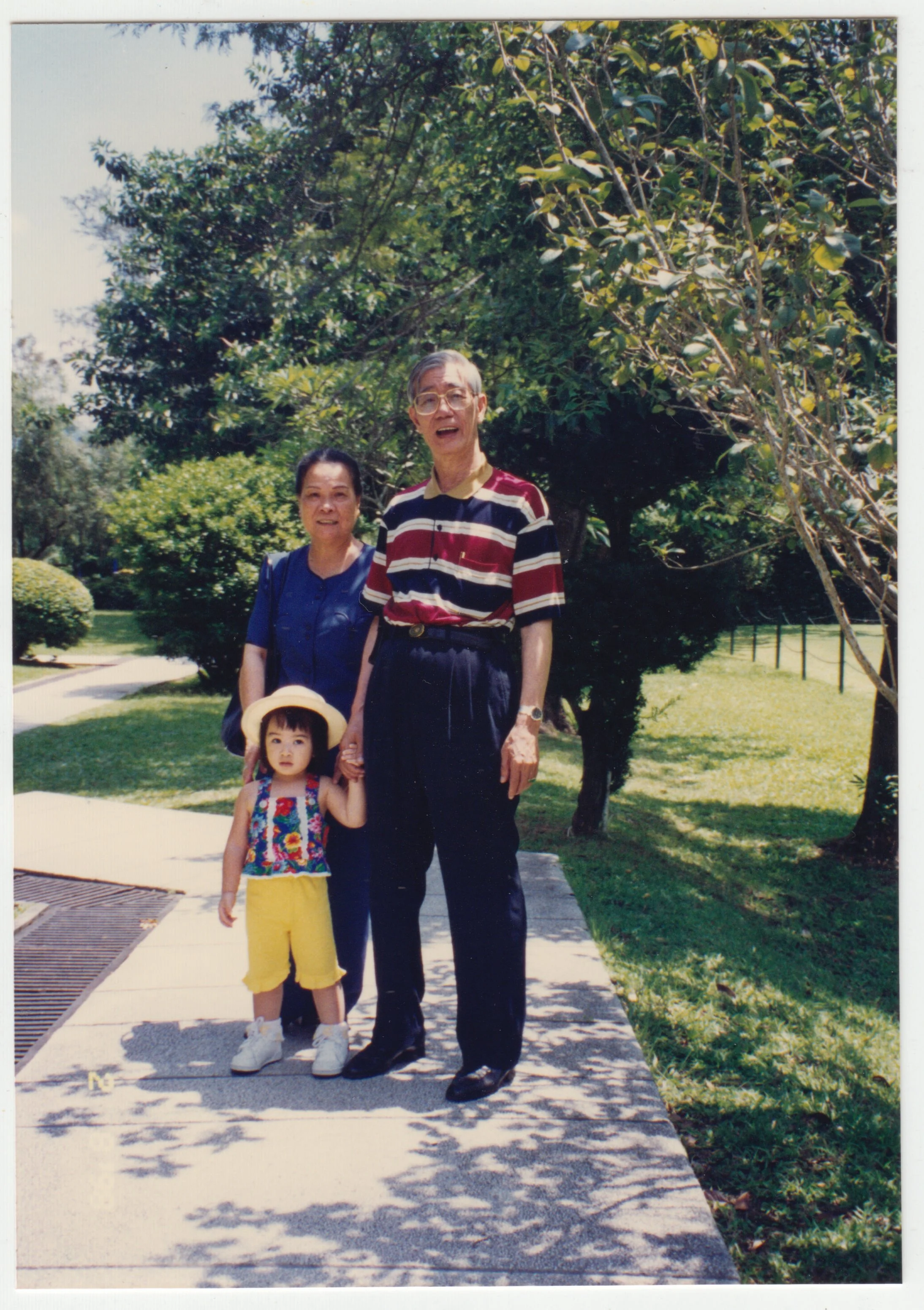 Grandma, Grandpa, and Charlotte at a park for a picnic, c. 1997 - 1998.