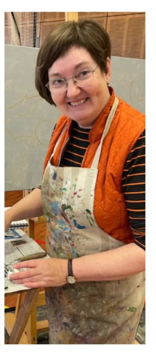 Artist Catherine Fitz-Gerald looks up smiling