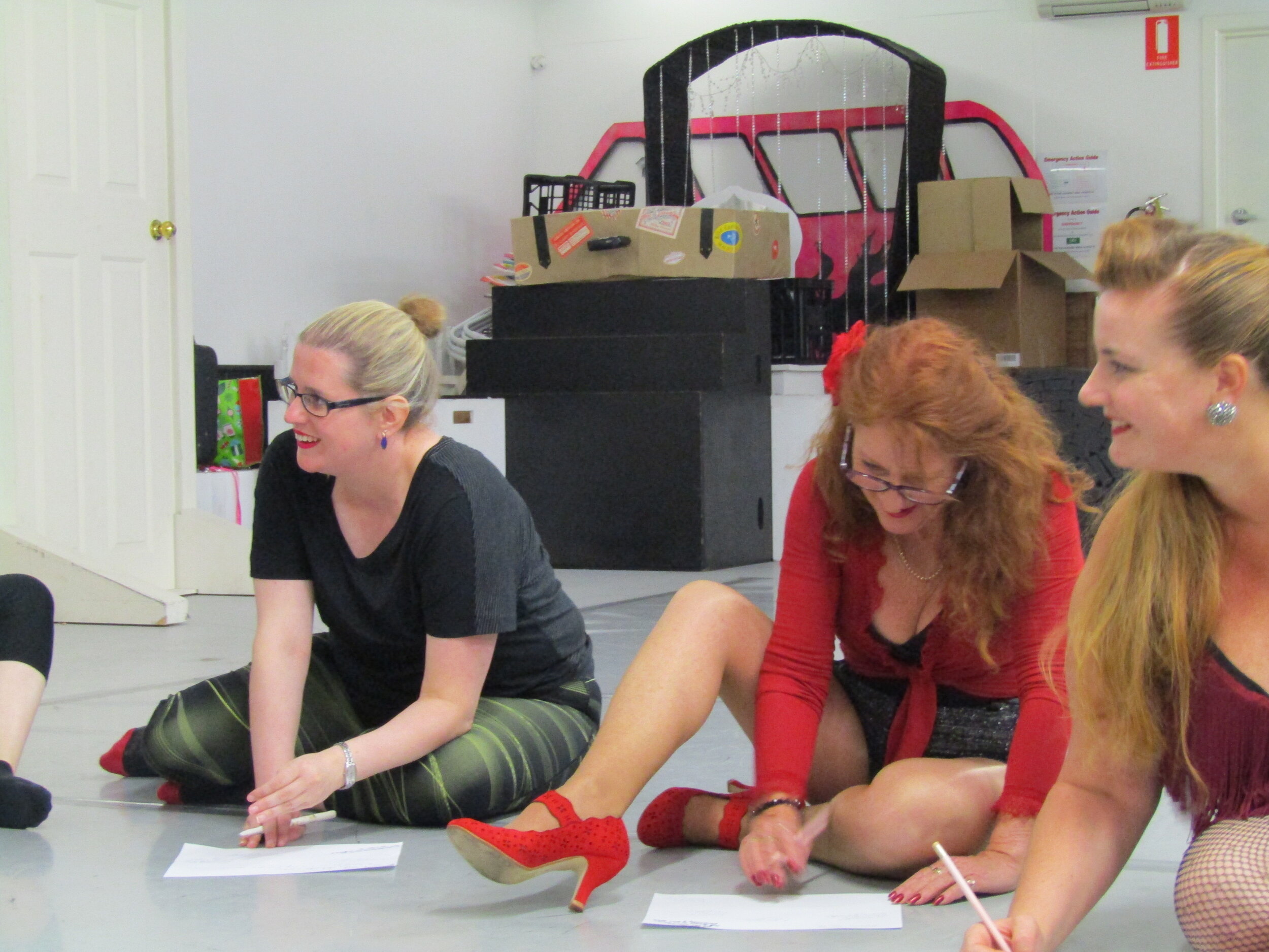 Hobart burlesque students filling out their feedback forms