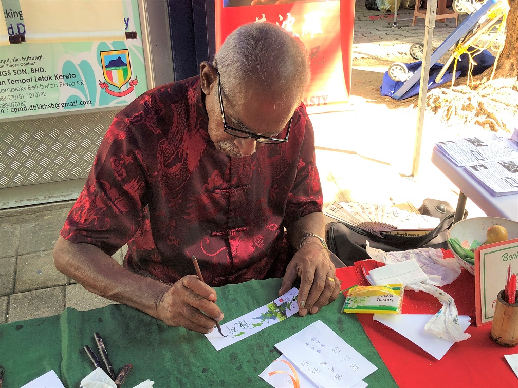  Artisan at work. Mr. Poolohgasingham is a self-taught calligrapher 