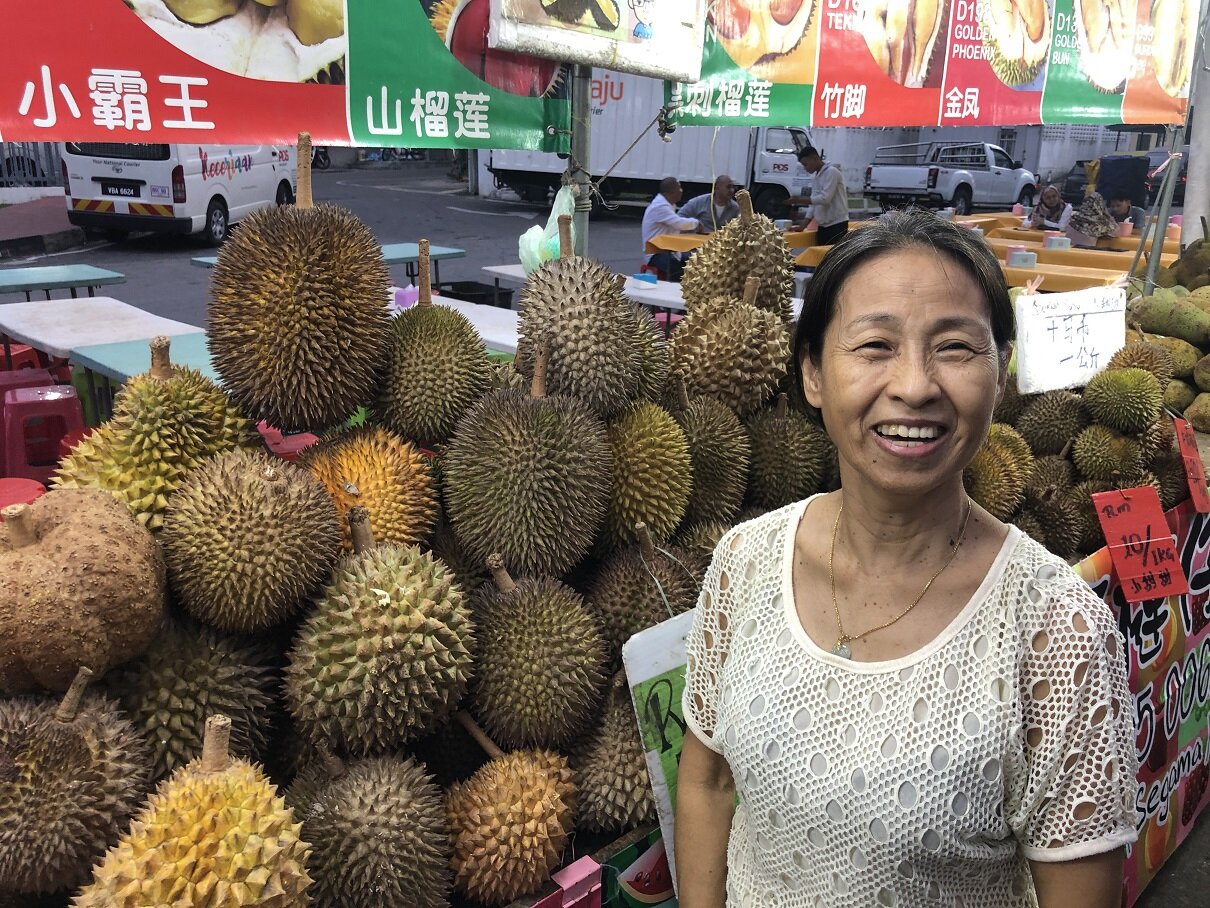  Madam Chua beside her durian stall 
