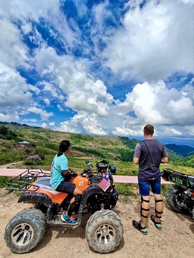 Taking a break from an ATV Ride at Sosodikon Hill to admire the beautiful scenery