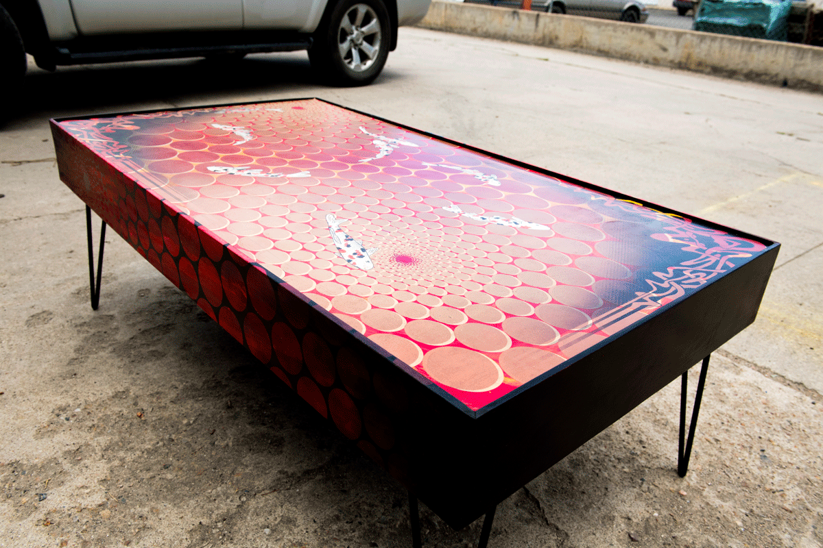  lavafish table  49"x27"x18"tall  mixed media on maple panel with steel hairpin legs. 