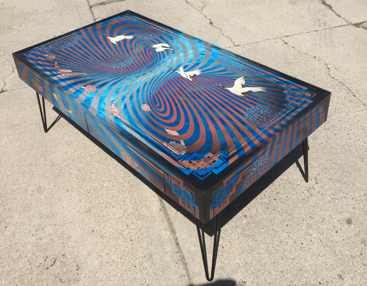  katy’s monster  commissioned coffee table measuring 49"x27"x18" tall  mixed media on maple panels with steel hairpin legs. 