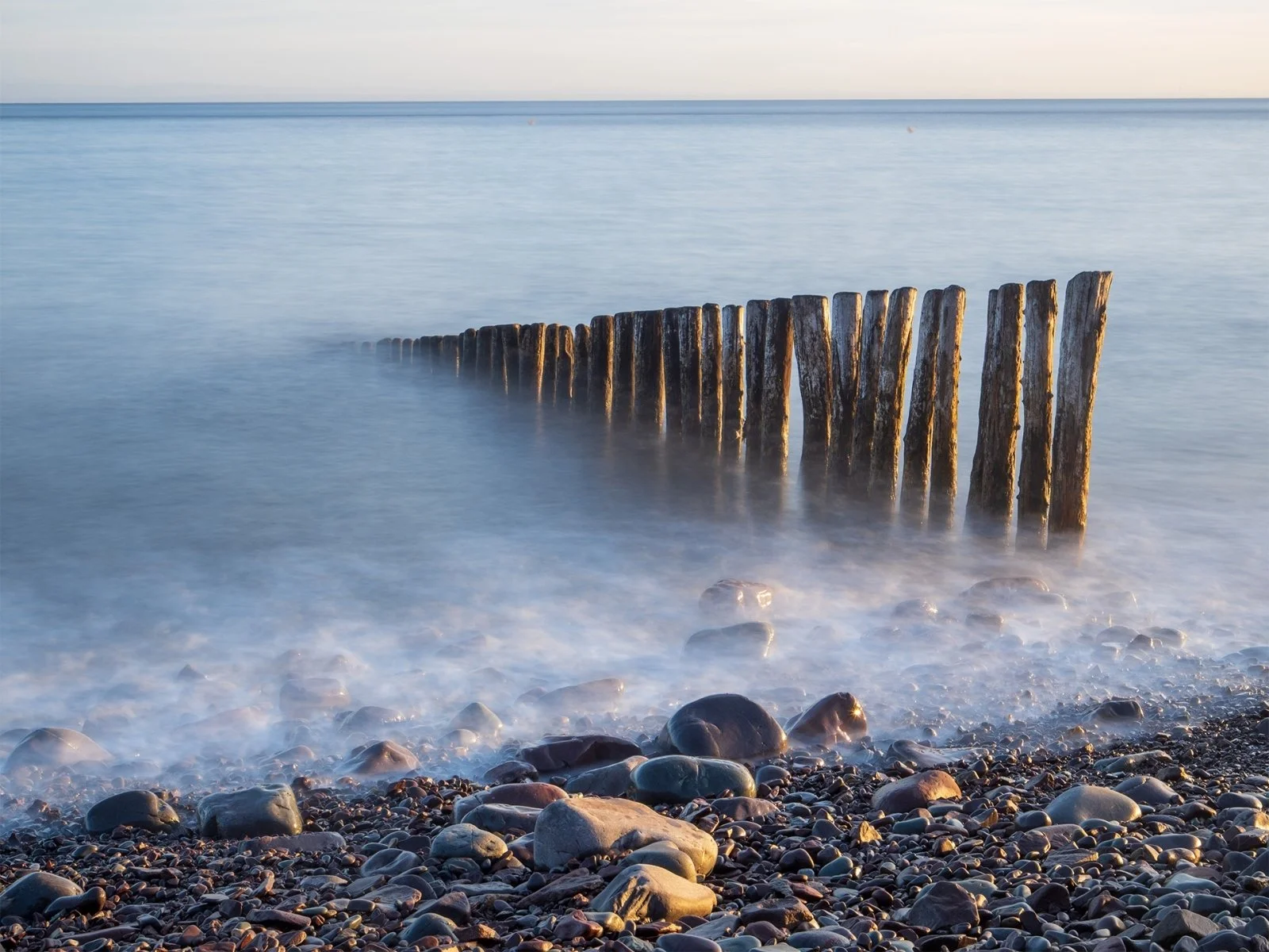 Porlock Groynes at Dawn by Jennie Williams