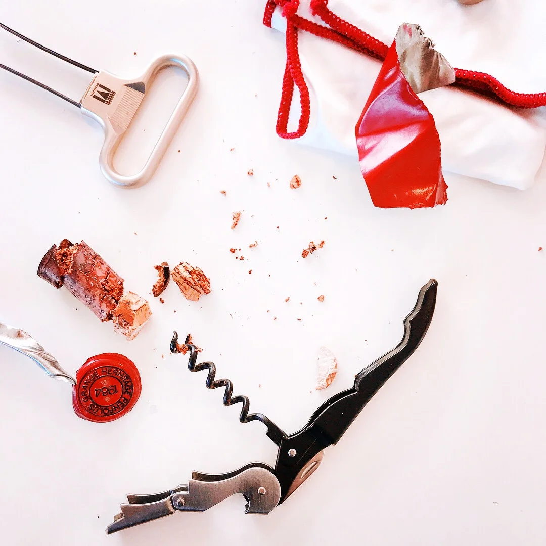 The surgical operation uncorking the bottle of Grange.