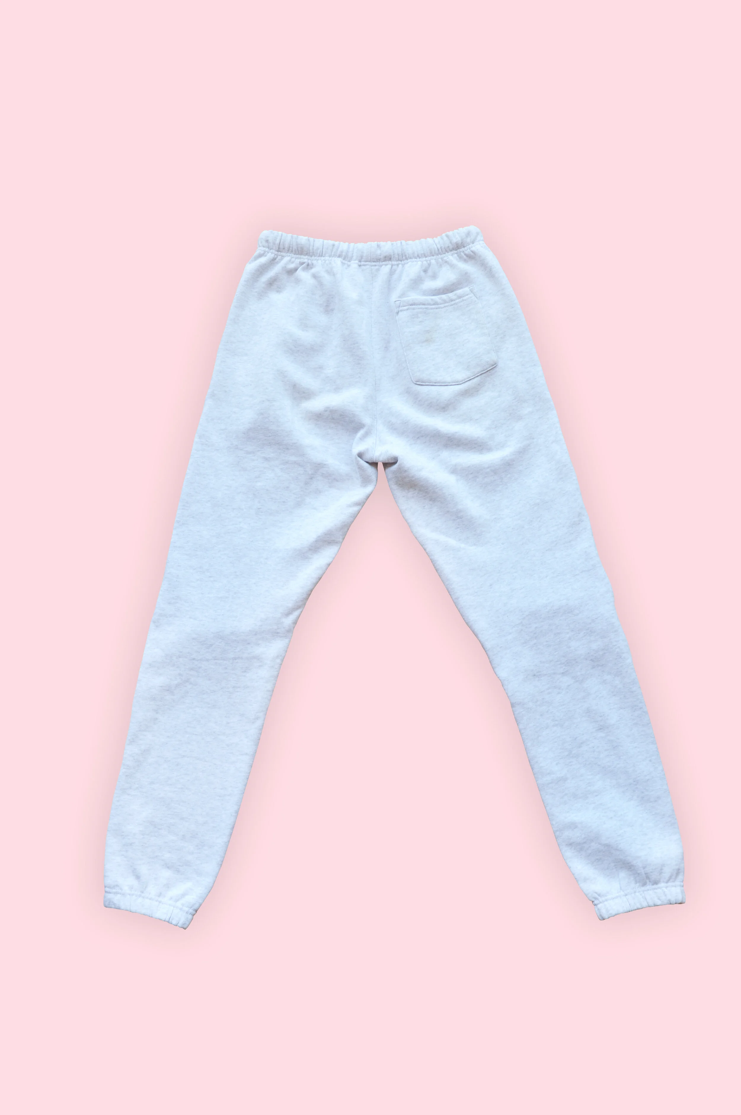 TØSLongTrackPantsBack_DeepEtch_PinkBackground_Shadow.jpg