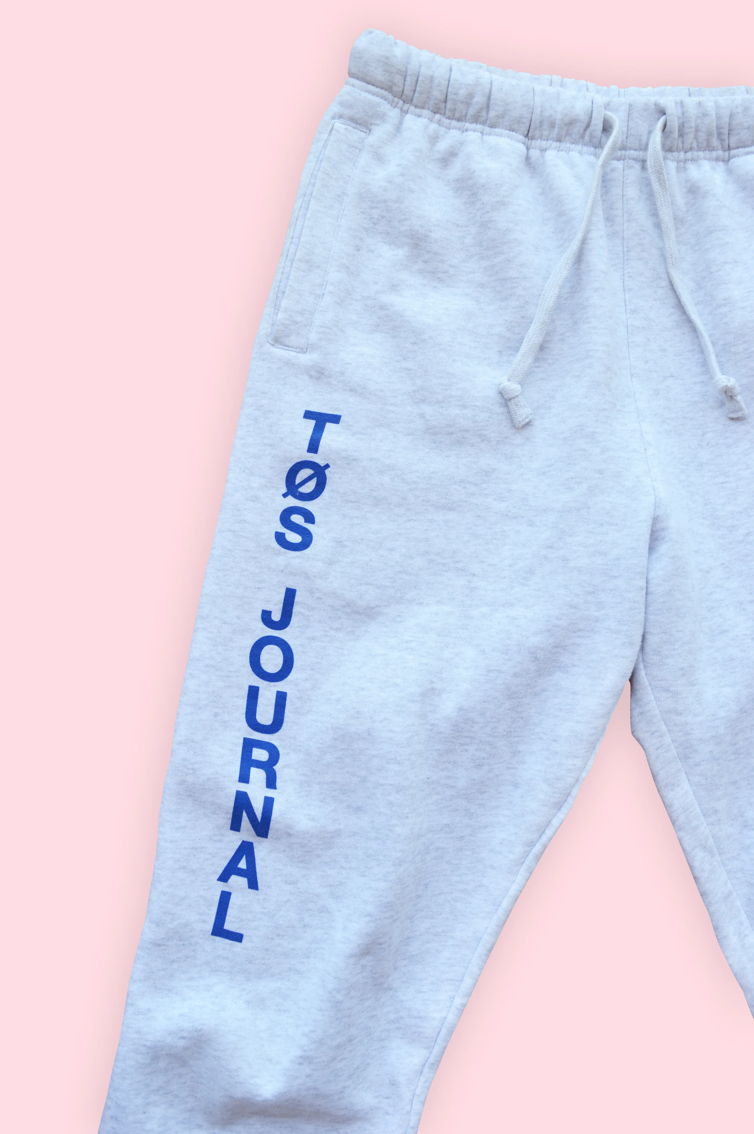 TØSLongTrackPantsCloseUp_DeepEtch_PinkBackground_Shadow.jpg