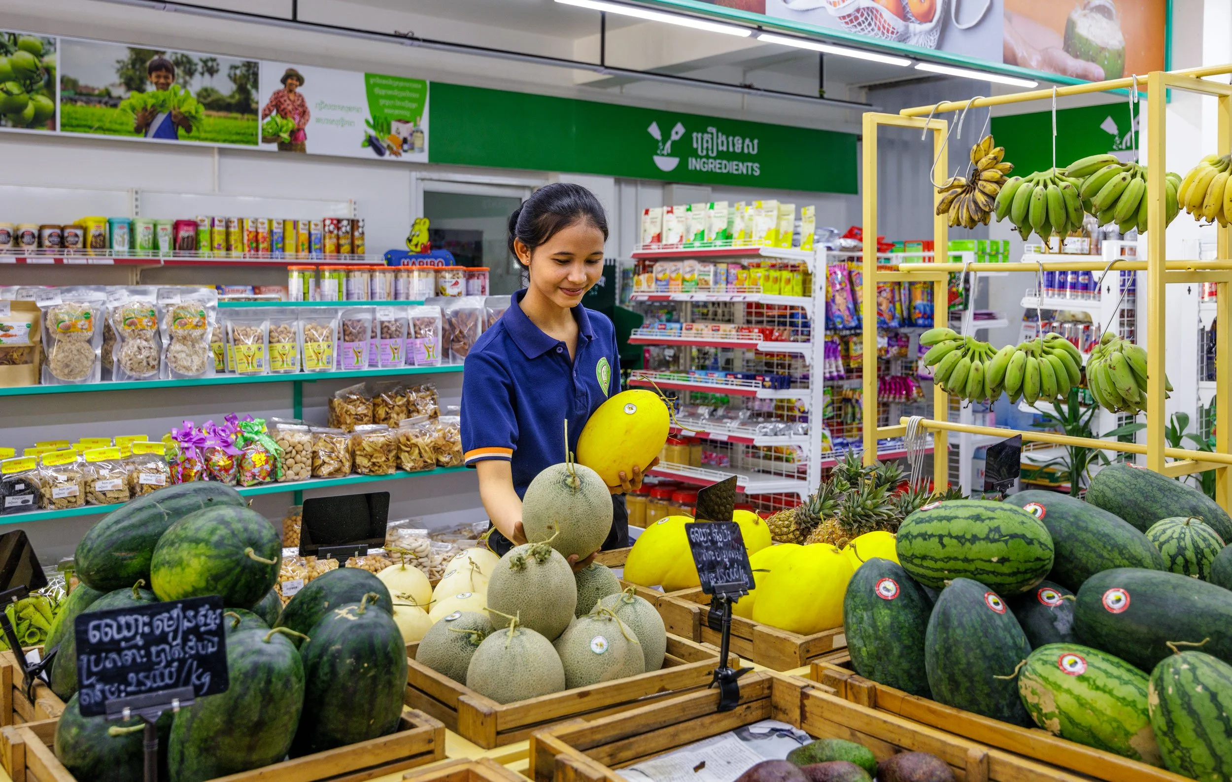  From Field to Shelf — Documenting local produce placement and retail value chains at the Ingredients specialty market, showcasing the commercial distribution of iDE-supported smallholder melon harvests in Cambodia. 