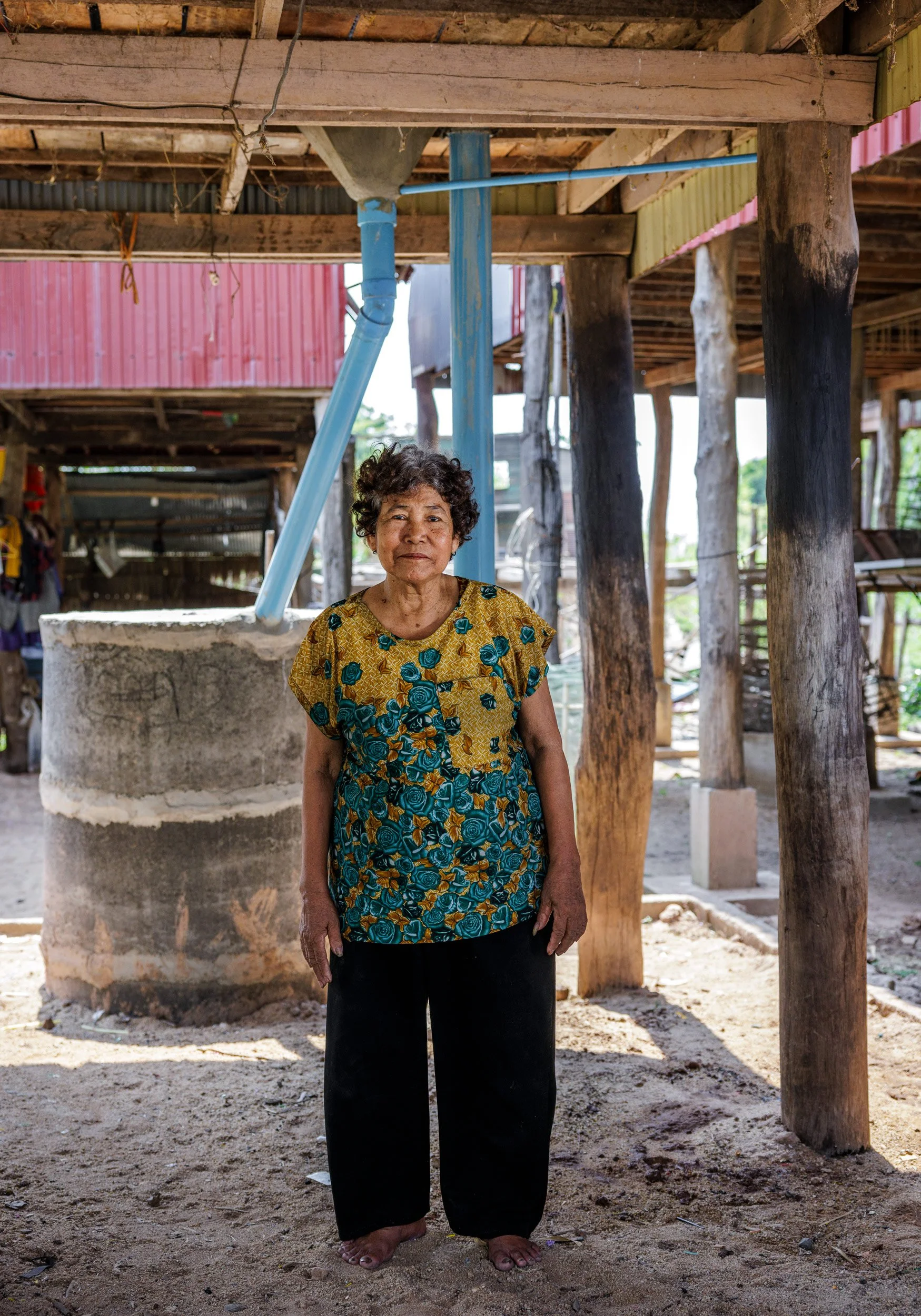  Faces of Impact — An environmental portrait of an elder community member benefiting from climate-resilient household latrine and plumbing systems on a Tonlé Sap lake island, in partnership with iDE Cambodia. 