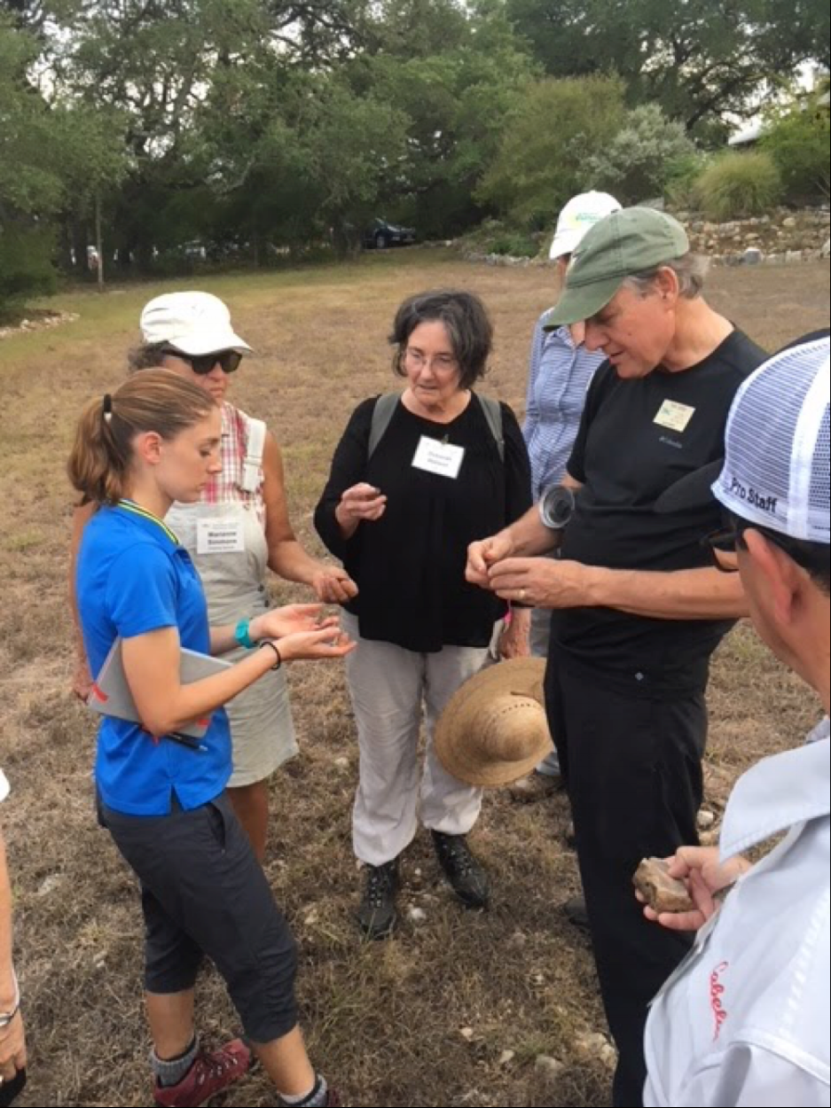 Tom Jones works with members of the 2018 Master Naturalist class in identifying and talking about different pieces of flint and Karst Limestone encountered on the ranch walk
