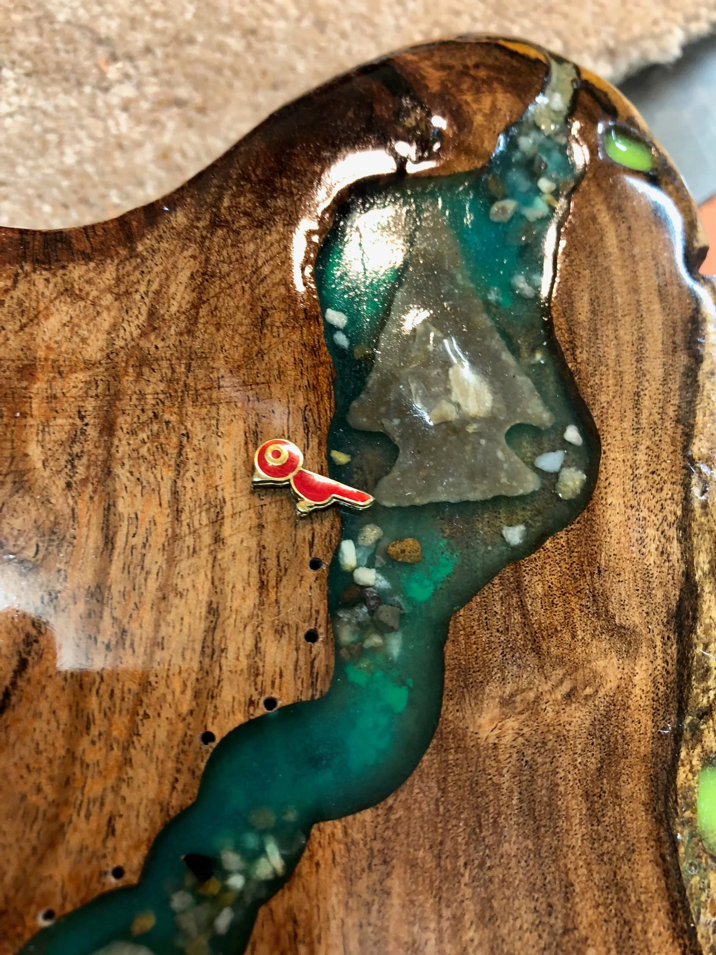 He added natural elements to give it an authentic Texas Naturalist appeal – a rattlesnake rattle, a fossil, an Ensor point, and more.