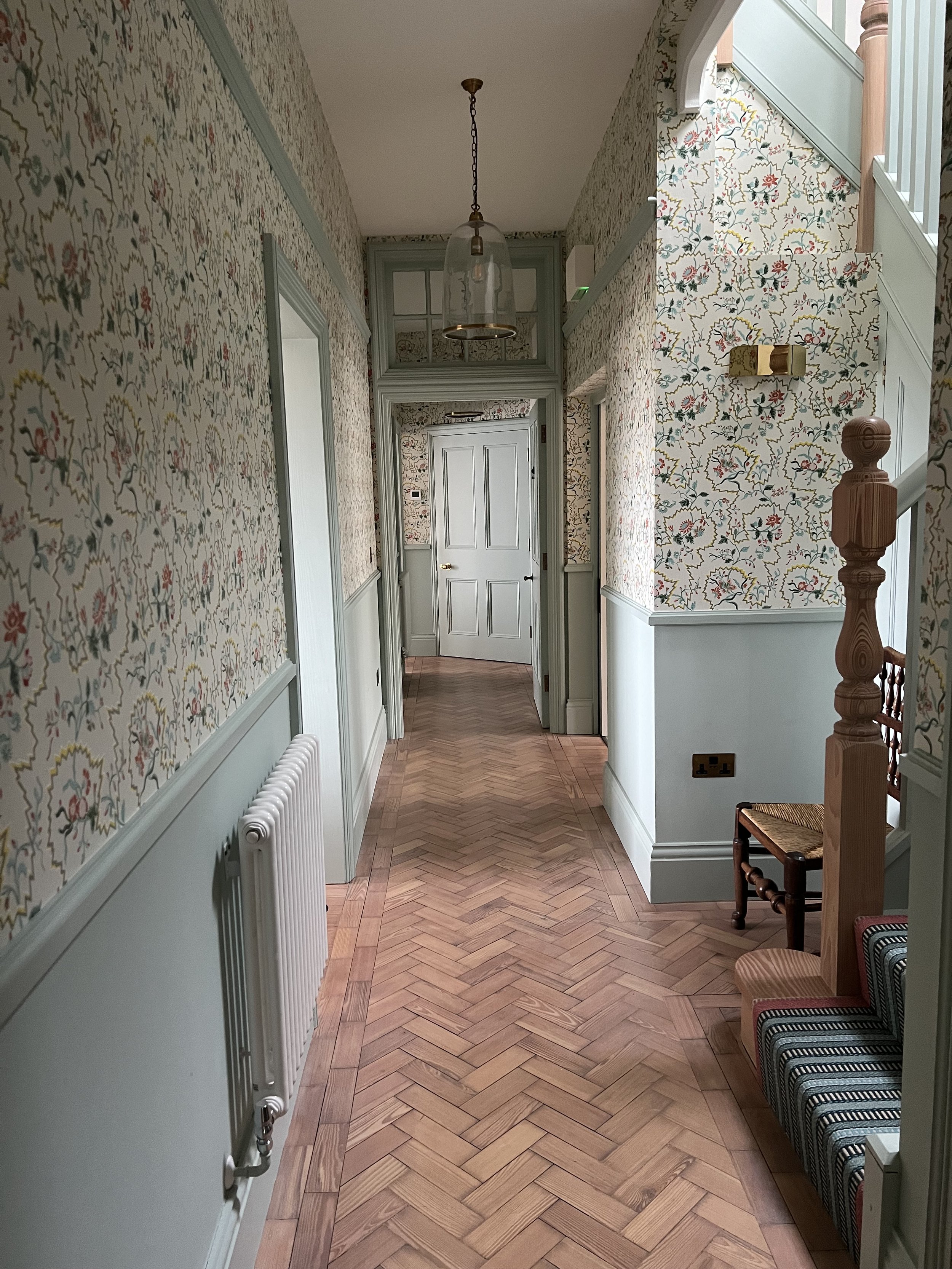 The stair hall with Pierre Frey wallpaper