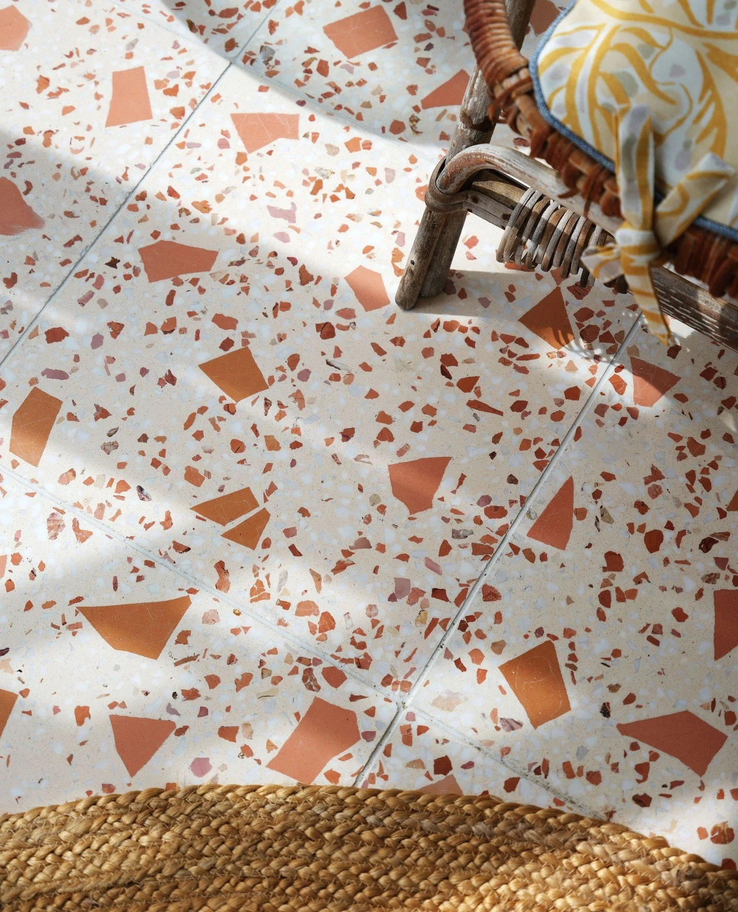 Holiday vibes in this sunroom we did in Anglesey. Beautiful terrazzo tiles from @bertandmay and @christopherfarrcloth Mille Feuilles performance fabric giving new life to an antique rattan set. I hope you are enjoying your summer wherever you are! ⁠
