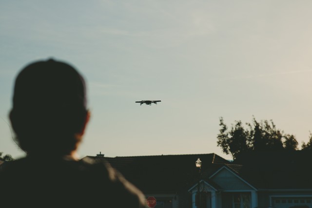 Drones must be flown within visual line of sight of the pilot and/or a spotter. (Photo by Caleb Woods on Unsplash.)