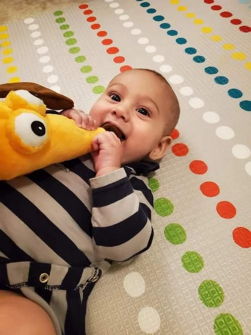 baby-with-puppet-toy.JPG