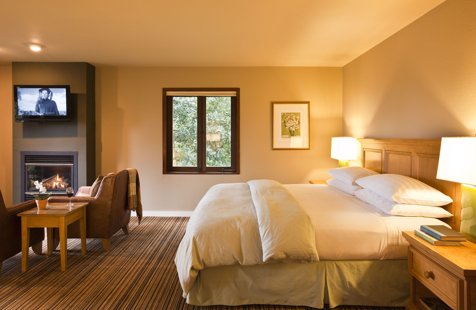 The Madrone room with comfy king size featherbed, flat screen TV, and leather seating around a fireplace