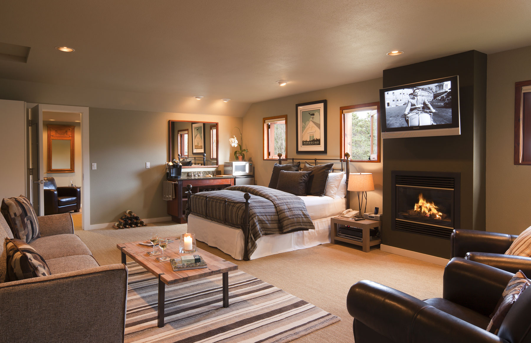The Meadowview suite with cozy fireplace and flat screen TV, king bed, and sofa