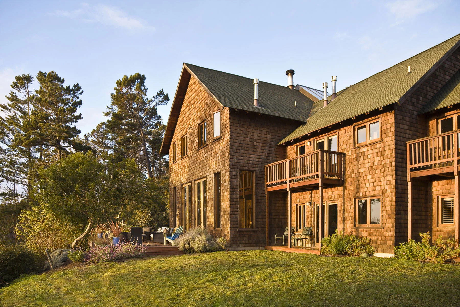 The back side of the Brewery Gulch Inn lit by the setting sun.