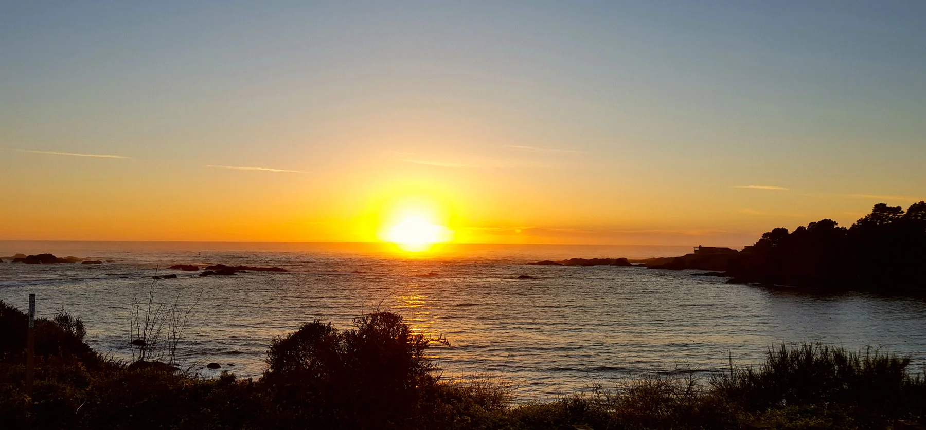 The sun setting over the Pacific Ocean.