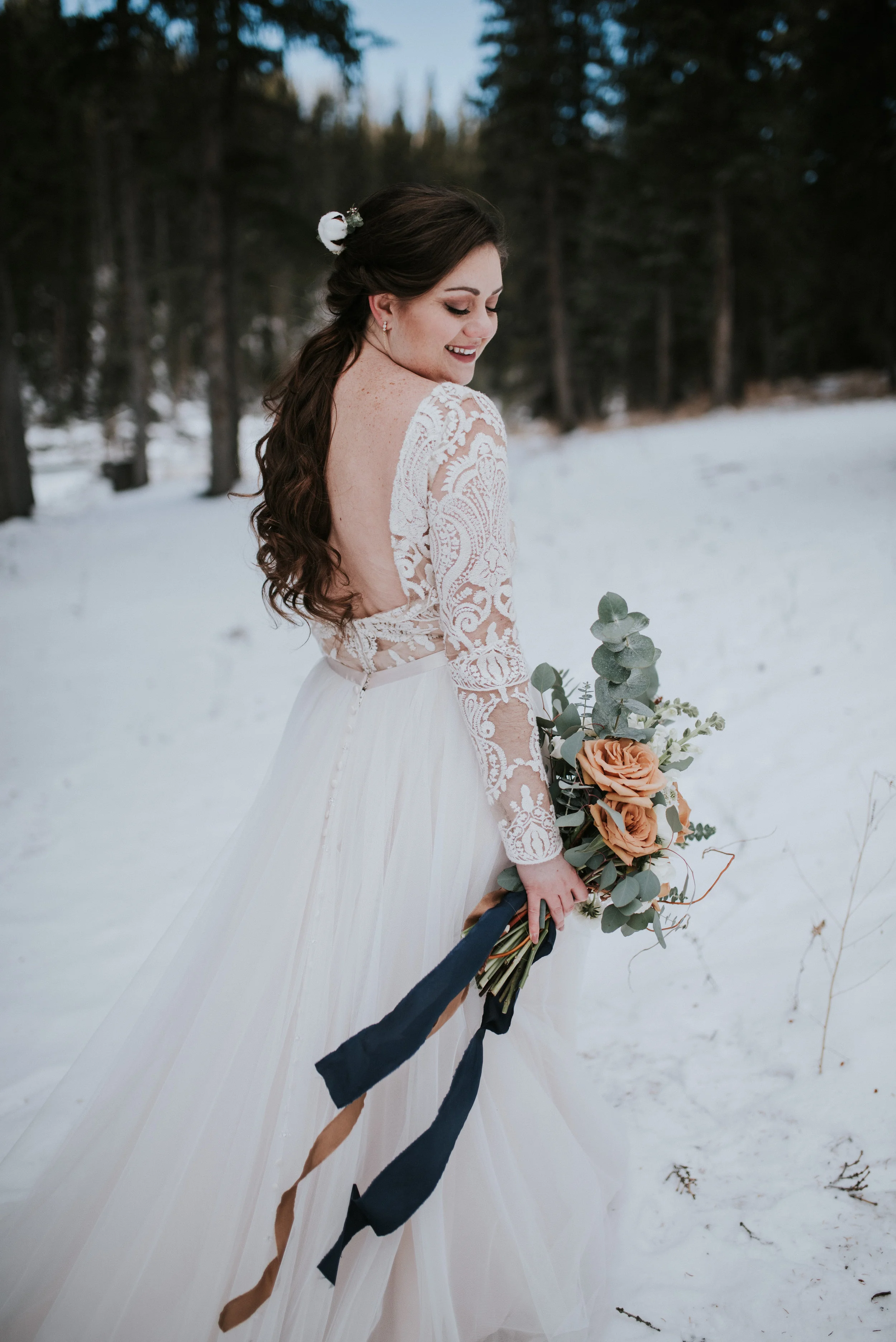 calgary winter wedding bride gown floral arrangement