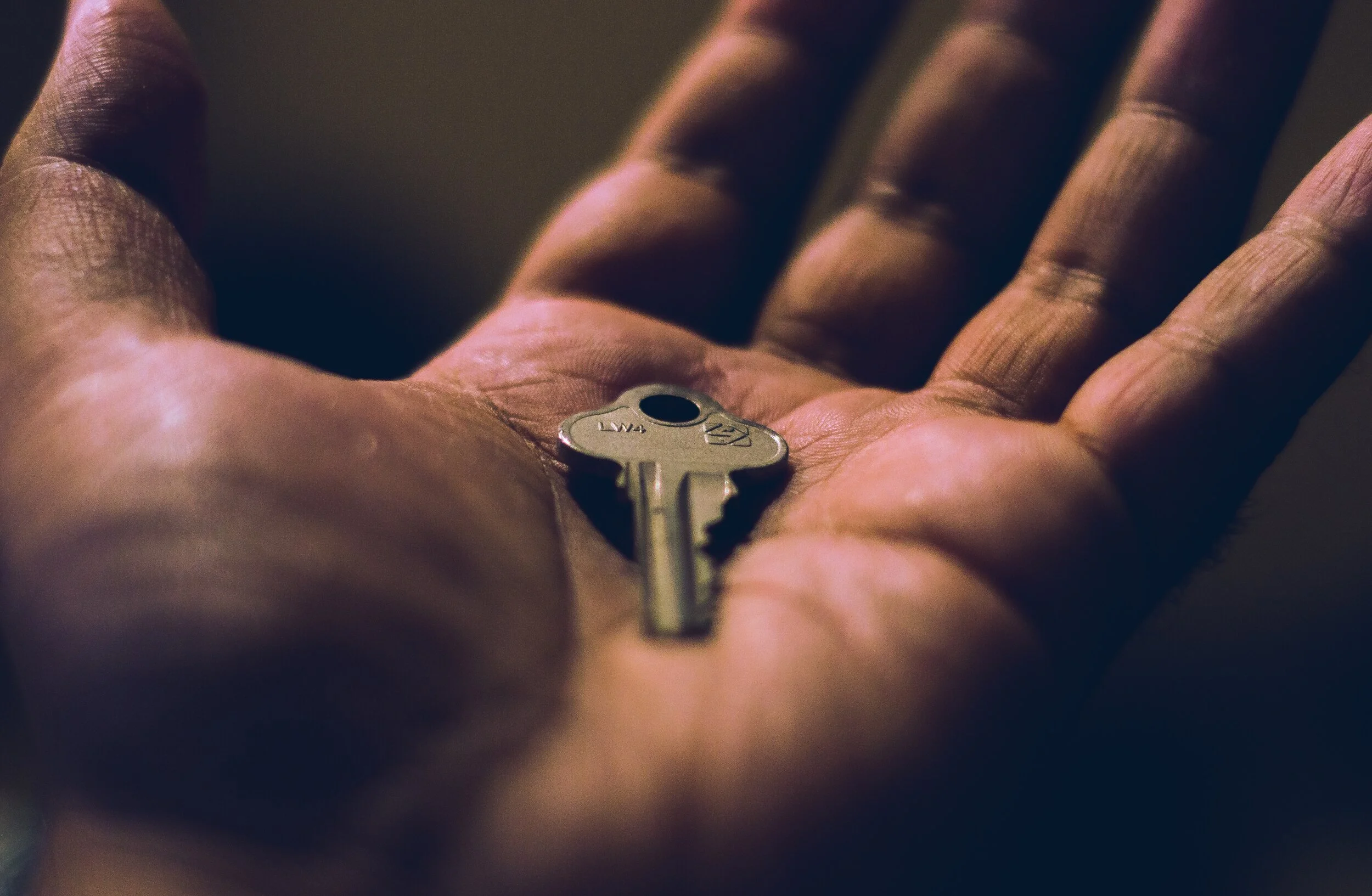 photo of a hand holding a key