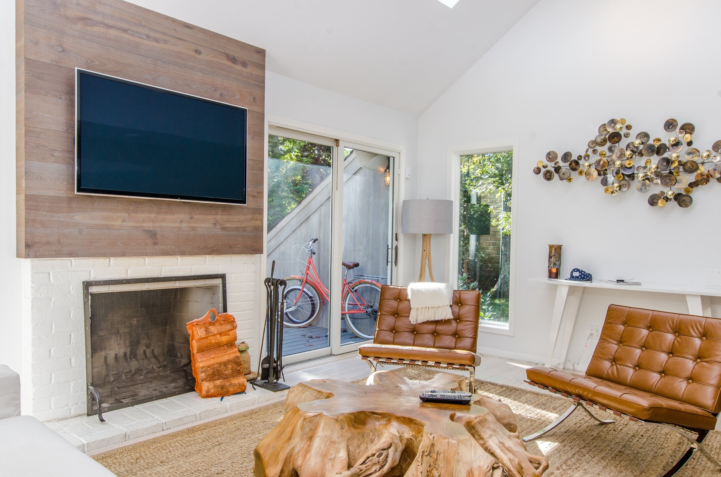 modern living room with fireplace and patio window