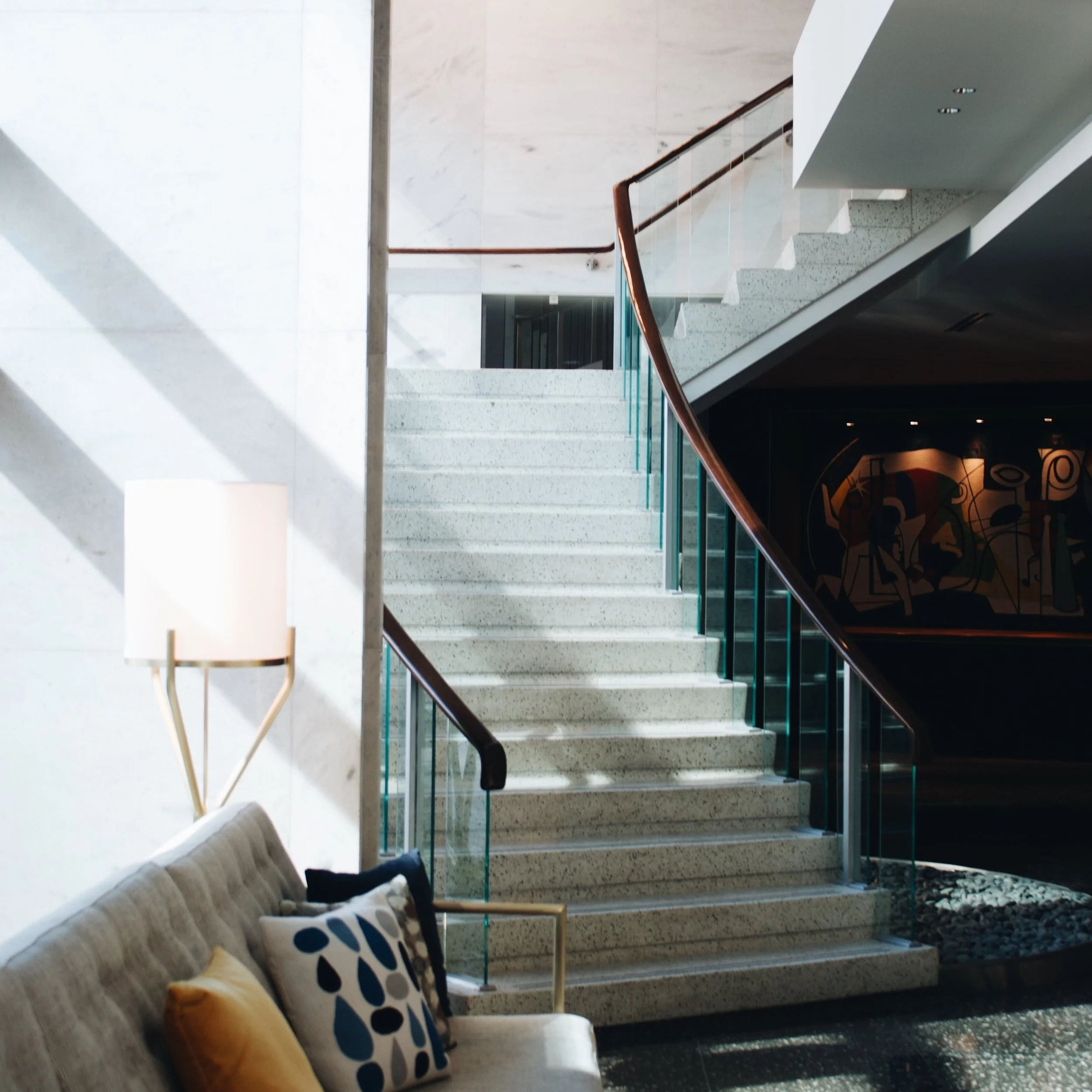 interior shot showing staircase and vaulted ceiling