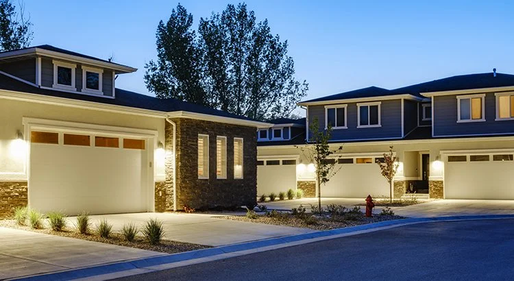photo of exterior of townhomes at twilight