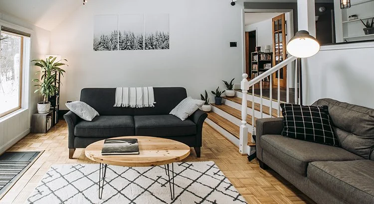 photo of a living room with a couch and round coffee table