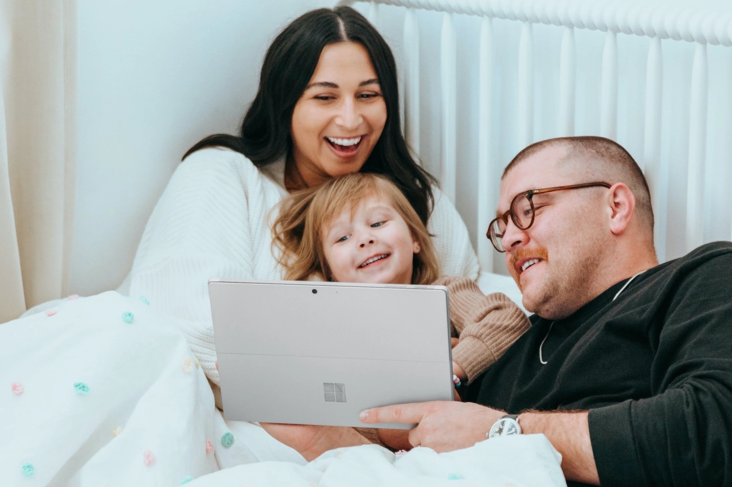 family looking at computer