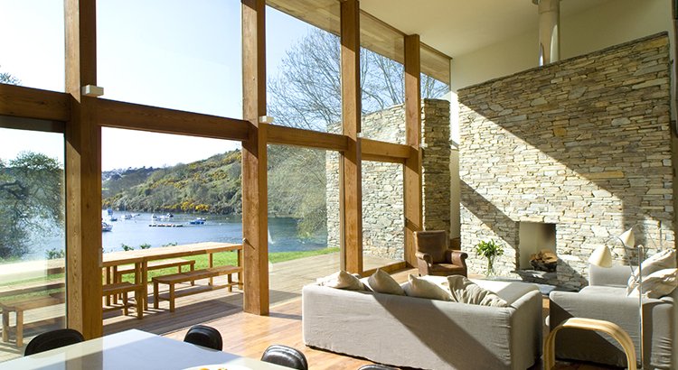 interior of a home with vaulted ceilings and a waterfront view