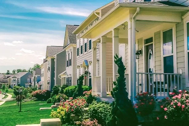 view of homes along a street with sidewalk