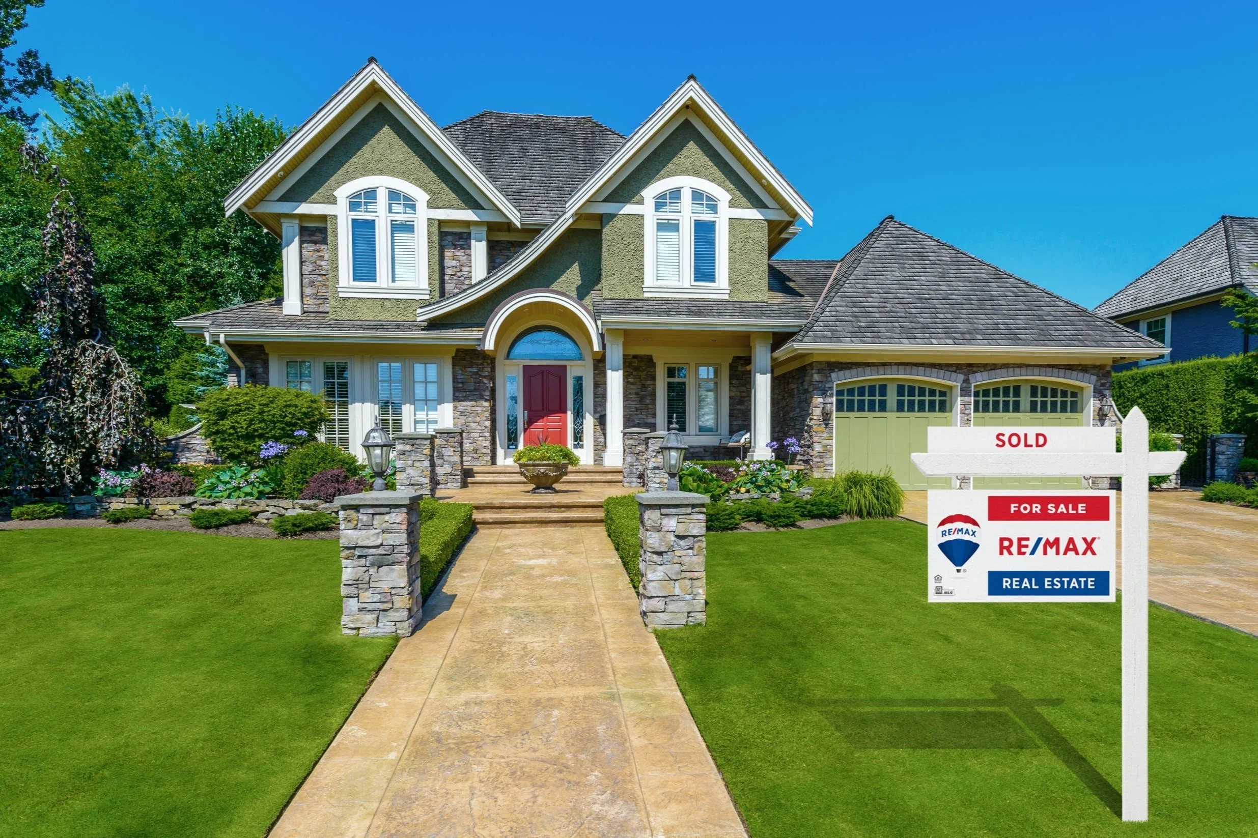 exterior of home with remax sign in the front
