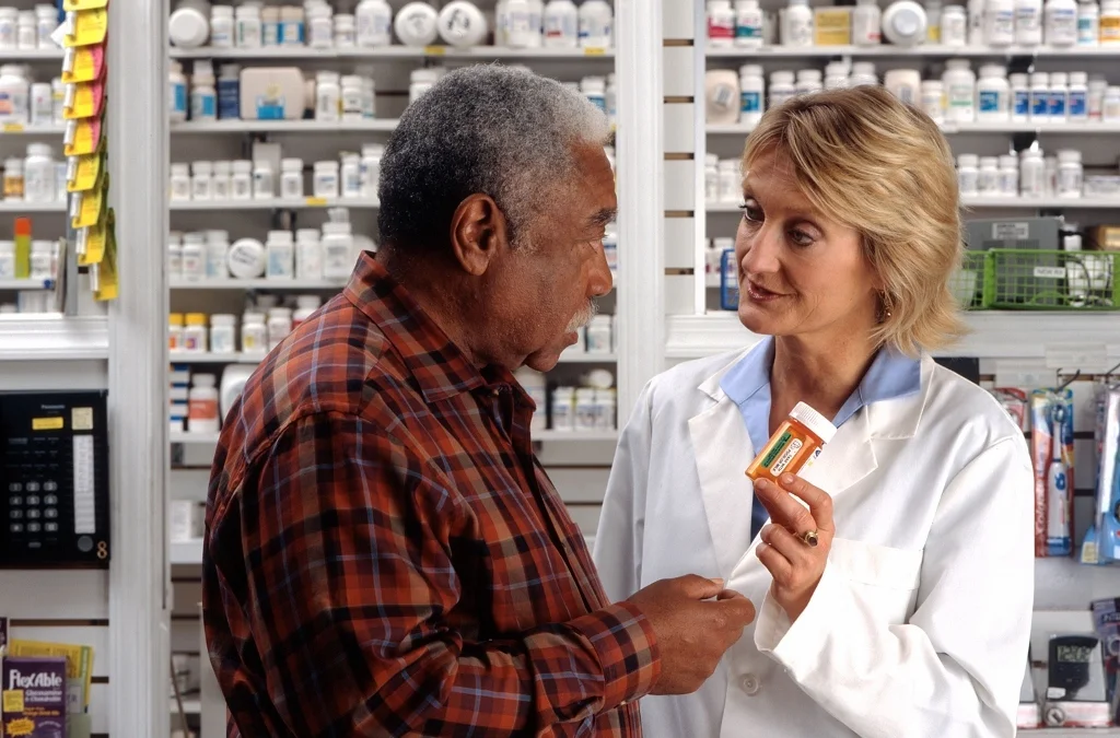 Pharmacist_and_Man_HIPAA_Healthcare_med-1024x675.jpg