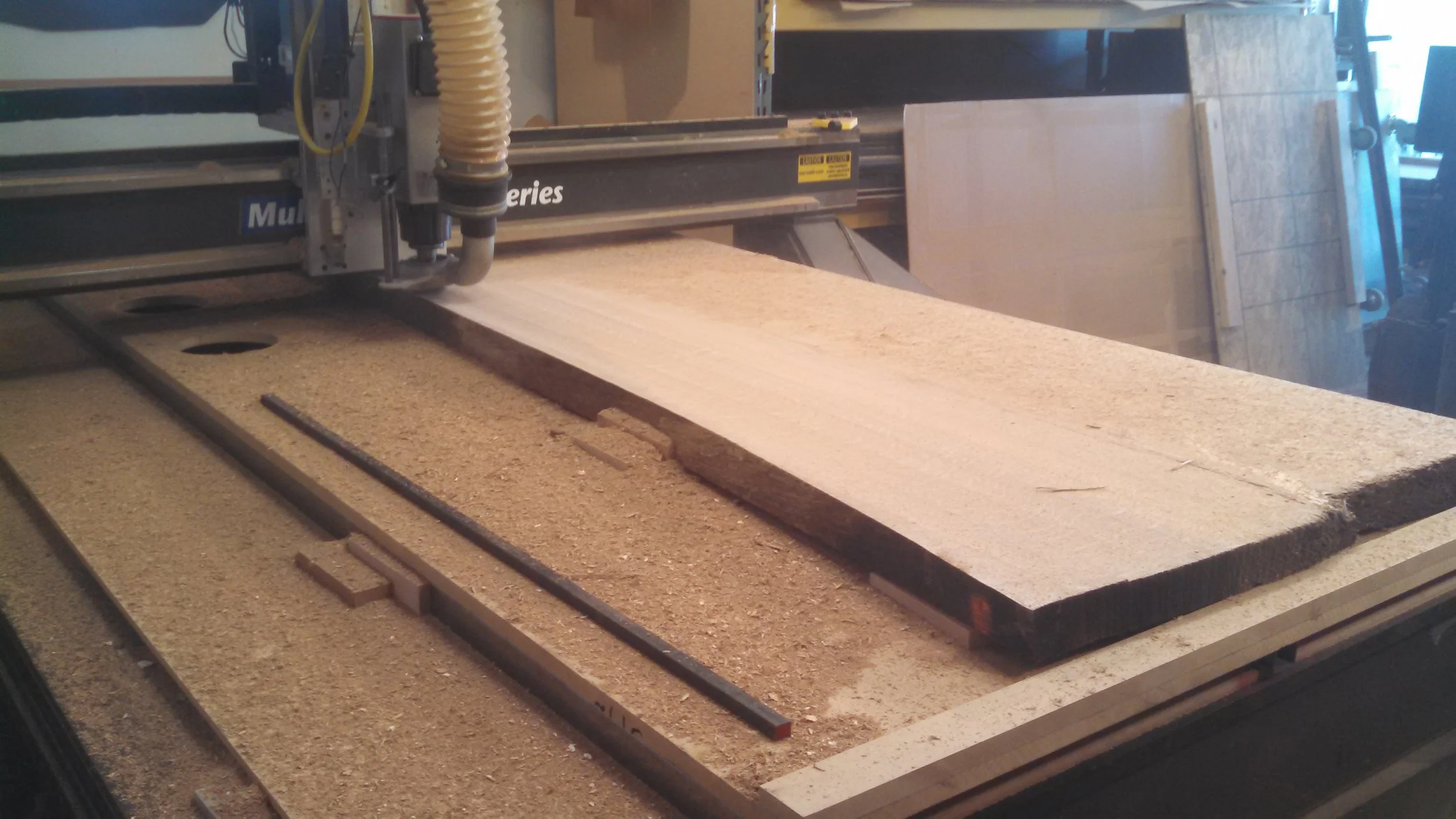 surfacing large live edge solid wood slab on our CNC router