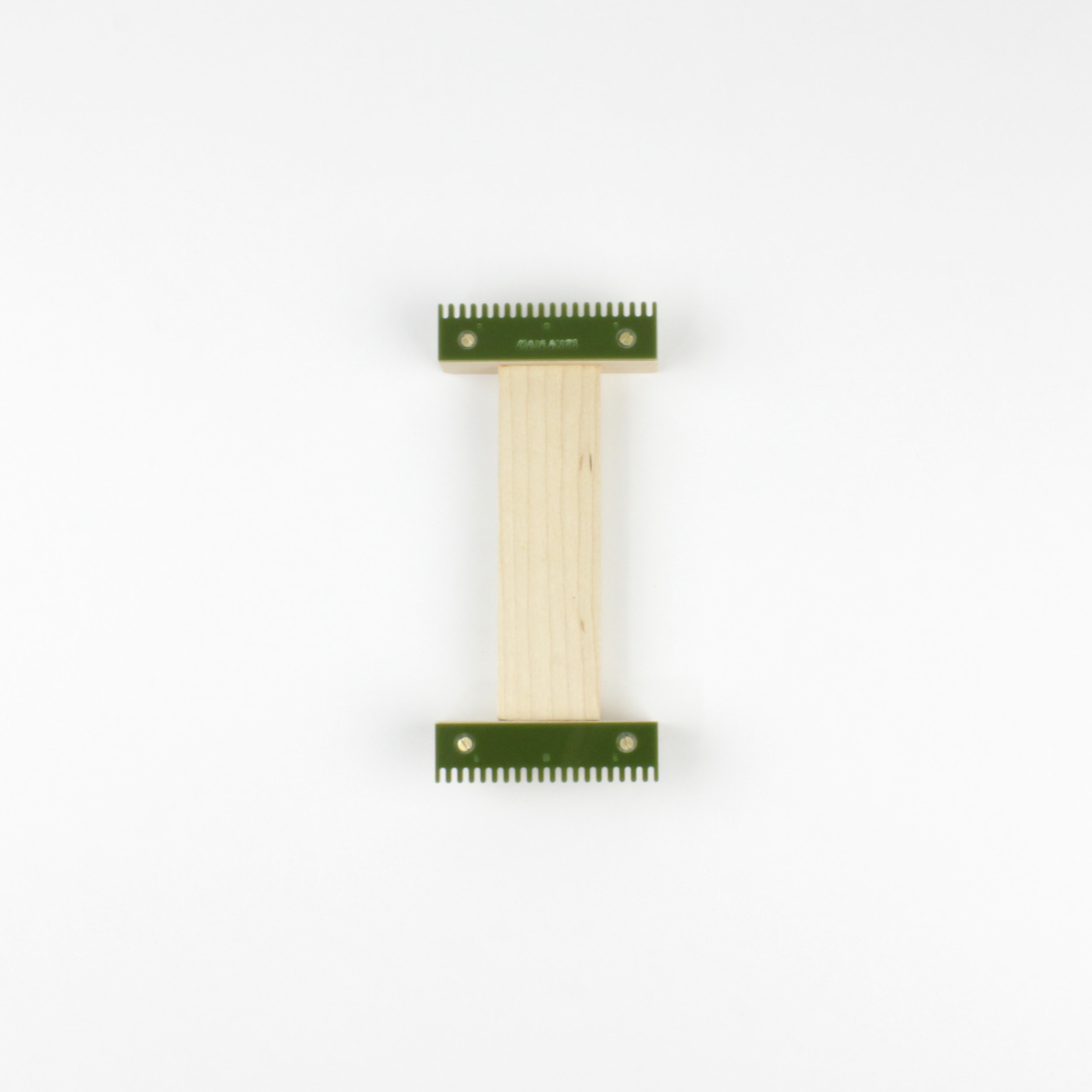 green tiny tapestry weaving loom
